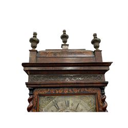 William & Mary floral marquetry 8-day longcase clock c 1700, later mid-18th century four pillar rack striking movement with a square brass dial and subsidiary seconds dial, ringed winding holes and calendar aperture to the matted dial centre, with London cherub head cast spandrels and (later) fretted steel hands, silvered Roman numeral chapter ring with stylised fleur di Lis half hour makers, narrow Arabic five-minutes, minute track and inner quarter hour track, signed Thomas Horlock, Hammersmith, 
case with box upstand to the domed floral marquetry decorated caddy with three brass flame finials, above a moulded cornice and fretwork frieze,  inlaid hood door with attached barley twist pillars to the front above an inlaid convex moulding, full length D moulded trunk door with a circular lenticle inlaid with floral and foliage panels inhabited with birds, on a conforming marquetry plinth with applied double skirting. Thomas Horlock is recorded as a Whitesmith & Clockmaker of Hammersmith, Middlesex.
A copy of Thomas Horlock's will dated the 15th June 1757 is held at The National  Archives Kew.