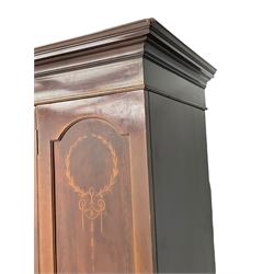 Edwardian inlaid mahogany wardrobe, projecting moulded cornice over central bevelled mirror glazed door, panelled uprights inlaid with trailing bellflowers and foliate decoration, the skirted base fitted with single drawer 