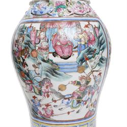 Large pair of 19th century Cantonese famille rose vases, each painted with various courtly scenes, including a display of warriors fighting on horseback before an official and his attendants, double Buddhist lion handles and applied at the shoulders with chilong, the lower band painted with Greek key motif, H58cm (2)