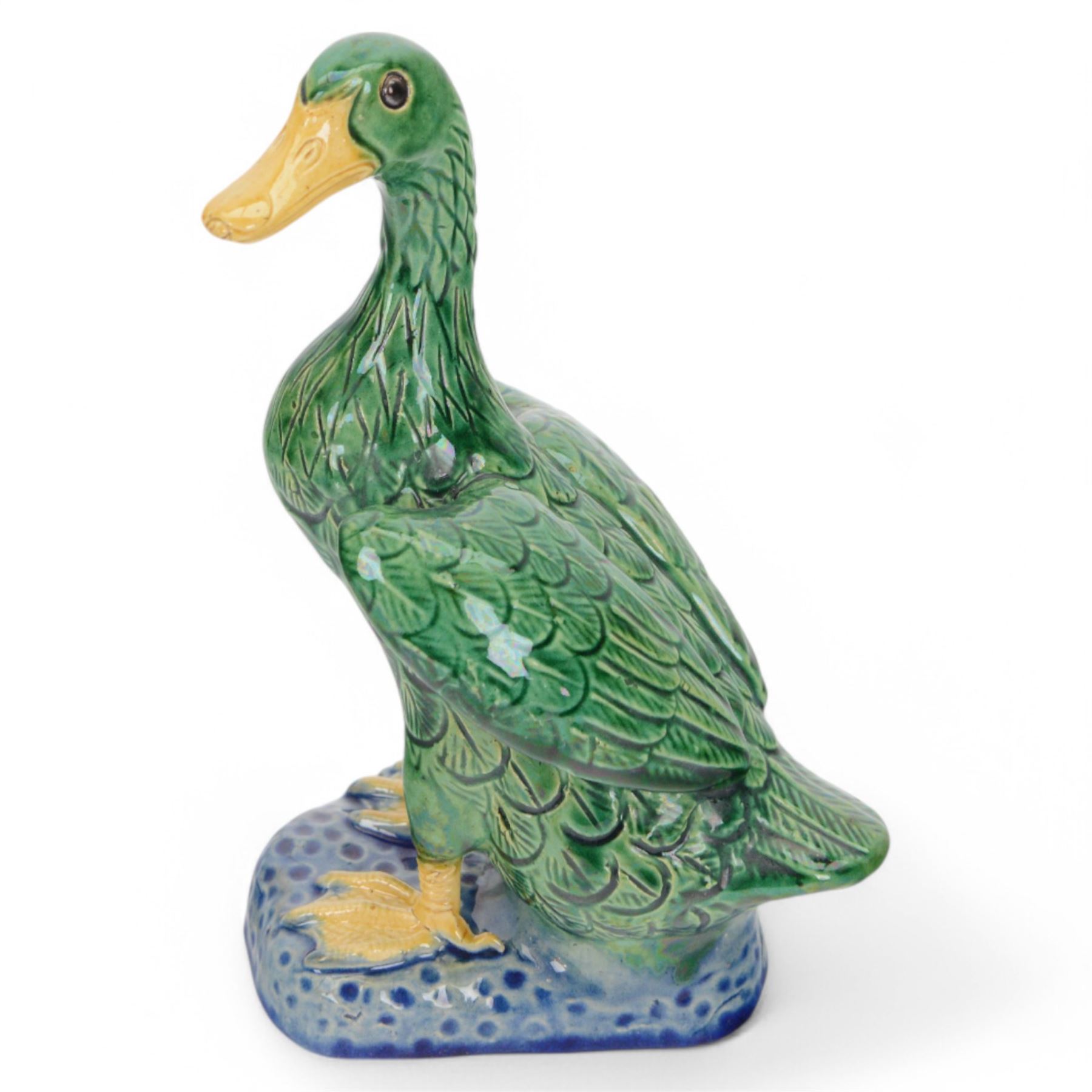 Pair of 20th century Chinese standing ducks, standing on a mottled base, H20cm