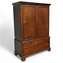 George III mahogany linen press, dentil moulded cornice over a pair of panelled doors encl...