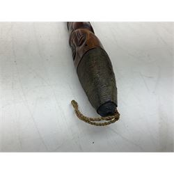 Tribal Art - an African axe, possibly Yoruba, the bone shaft carved as two cord bound stylised figures with iron fan-shaped blade, L35cm overall; and 19th century harpoon or spear head of square section with two long fixing arms on cut-down ash shaft L57cm (2)