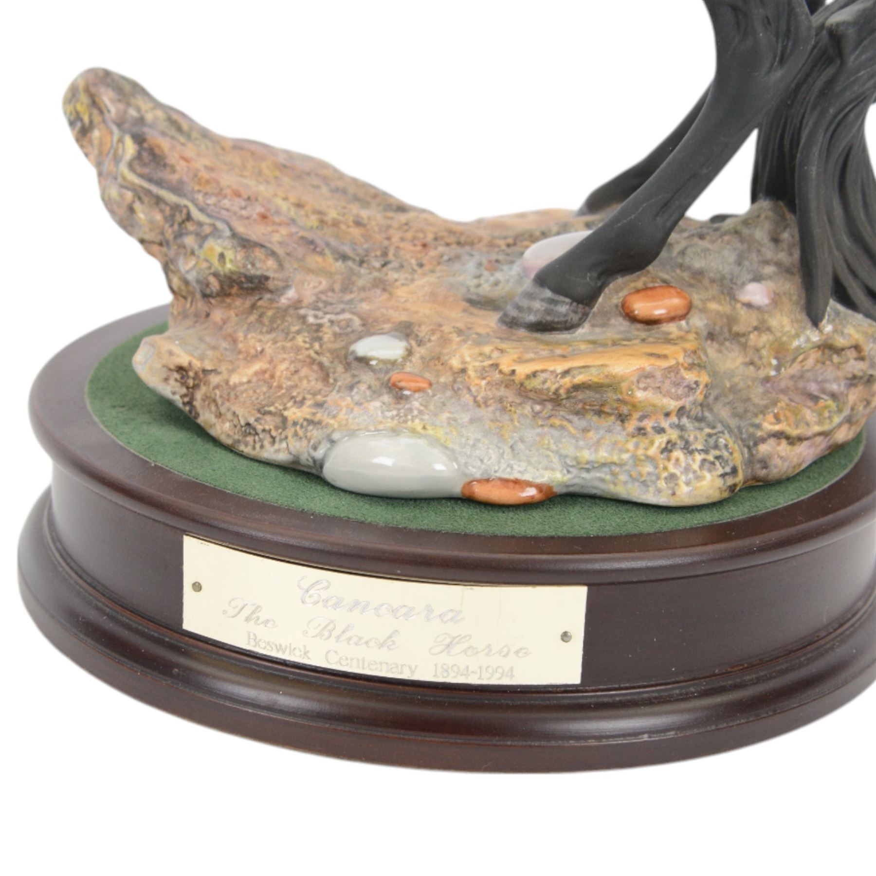 Beswick Cancara The Black Horse, designed by J. G. Tongue, modelled rearing horse on a naturalistic stony ground, upon a circular plinth with engraved title plaque, with certificate and in original box, H46cm 