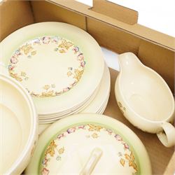 Clarice Cliff part dinner service, decorated with floral sprigs, including two covered tureens, six dinner plates, serving platter etc
