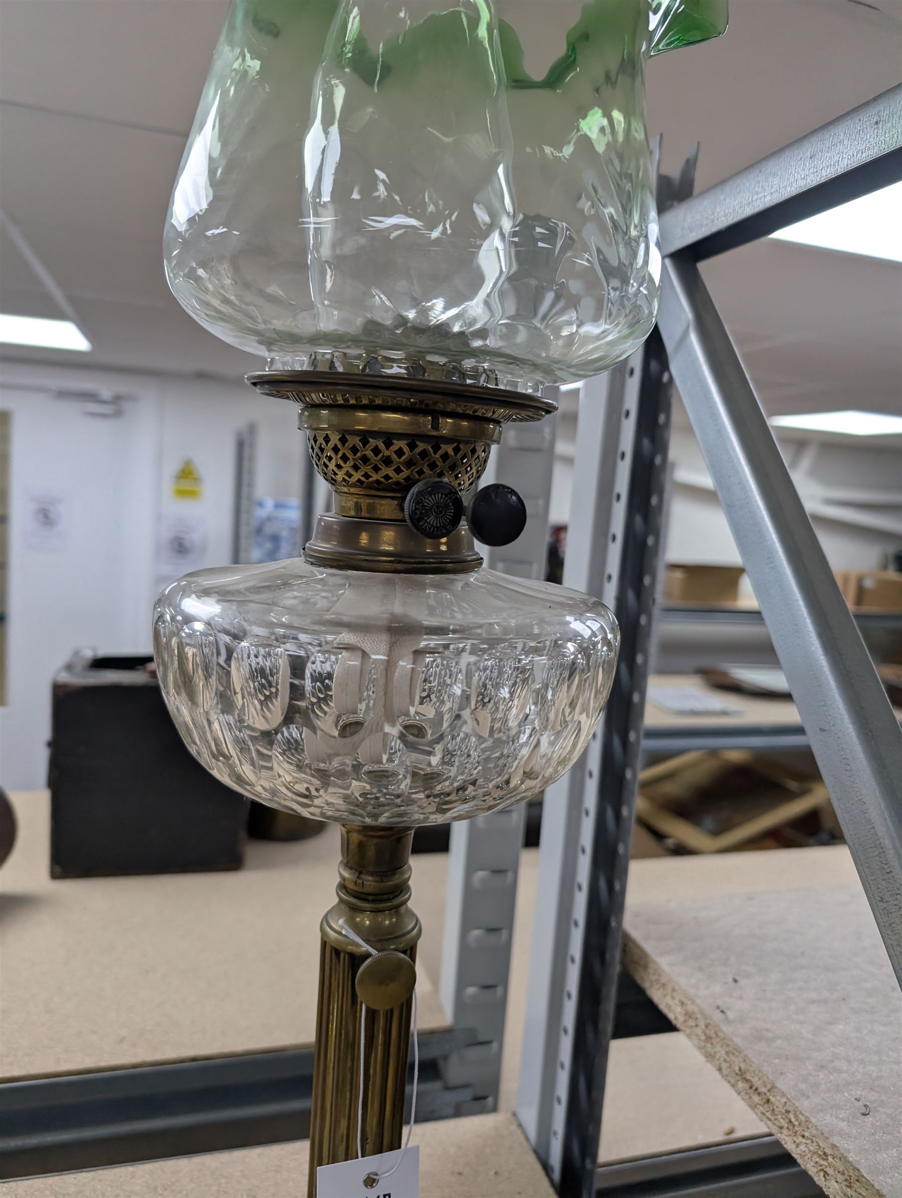 Oil lamp with frilled green glass shade, glass reservoir, upon upon corinthian column with stepped circular base, H74cm