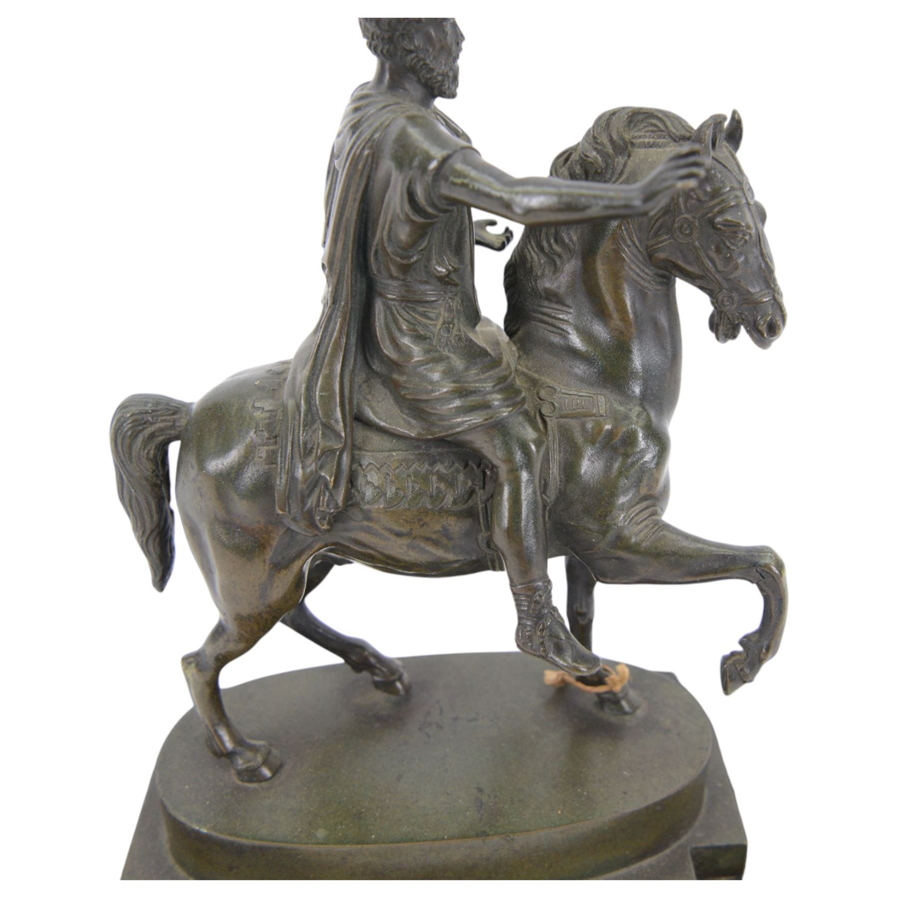 After the antique, bronzed figure of Marcus Aurelius upon horseback, on a rectangular stone base, H22cm   