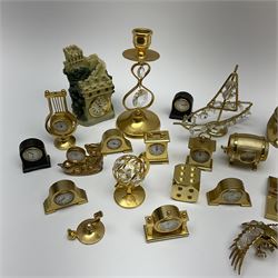 Collection of brass miniature clocks to include examples modelled as mantel clocks, grandfather clocks, robots, sunflowers, teddy bears etc, other similar miniature clocks and assorted brass and metal ware figures