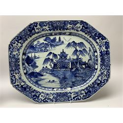 Pair of late 18th/early 19th century Chinese export blue and white platters, of canted form, decorated with landscape set with typical motifs including two figures upon a bridge, temple, and pagoda and huts upon islands, within cell diaper and scrolling foliate borders, W46cm 