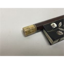 19th century wooden violin bow with a decorative mother of pearl inlay depicting flowers to the frog, with a bone adjuster screw
