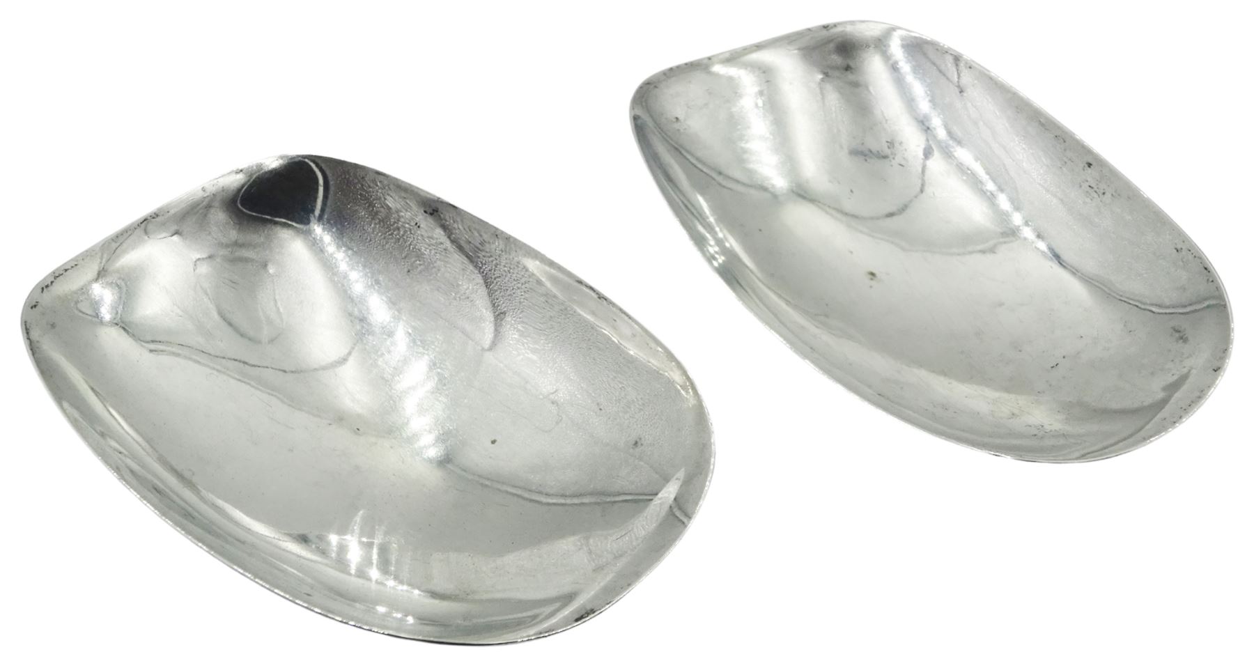Pair of mid 20th century silver nut rocker dishes, each of curved oblong form, hallmarked Geoffrey Guy Bellamy, London 1957, W10.5cm, approximate weight 3.21 ozt (100 grams)