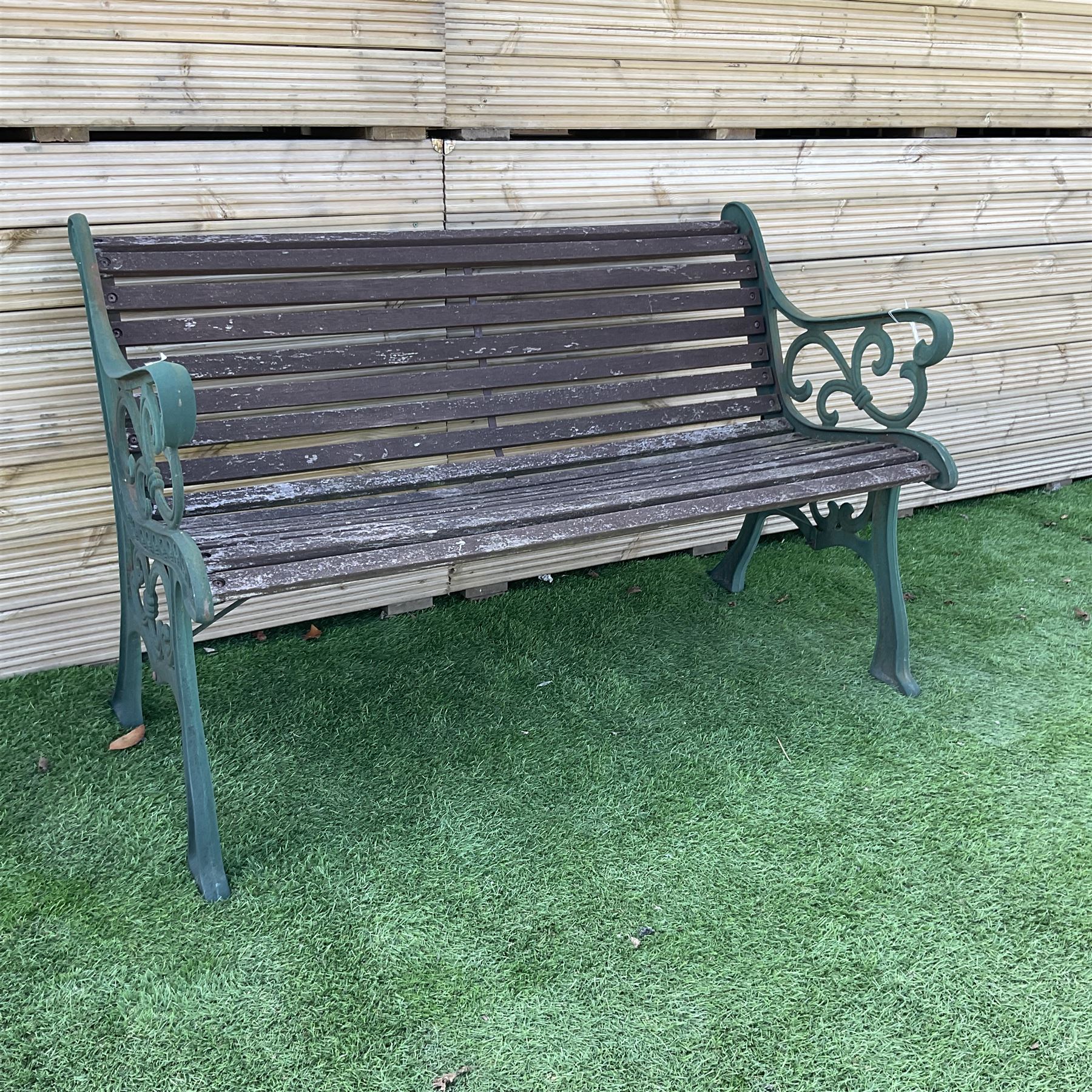 Cast iron and wood slated garden bench painted in green and brown  - THIS LOT IS TO BE COLLECTED BY APPOINTMENT FROM DUGGLEBY STORAGE, GREAT HILL, EASTFIELD, SCARBOROUGH, YO11 3TX