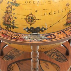 Late 20th century drinks globe, with lift off top with rotating inside with apertures for bottles, raised on brass castors