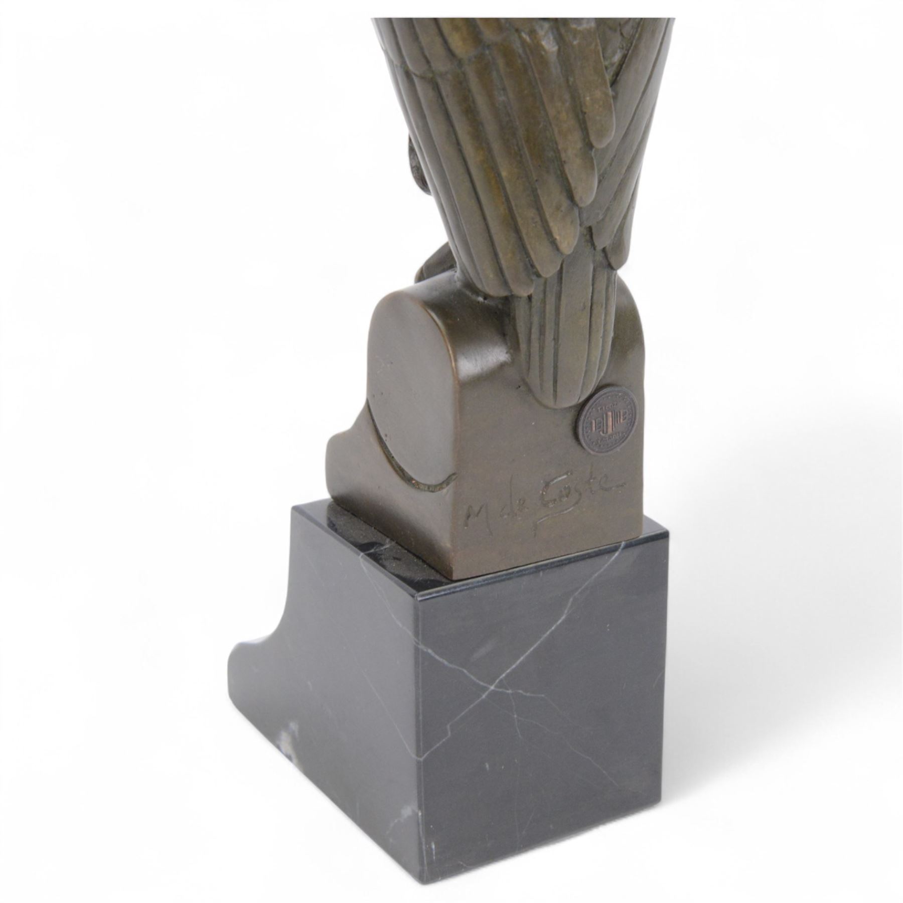 Bronze figure of a stylised eagle owl upon a marble base, H25cm 