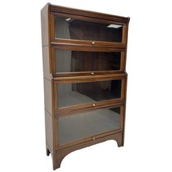 Kenric Efferson - early 20th century mahogany four-tier library bookcase, enclosed by four glazed up-and-over doors, on bracket feet