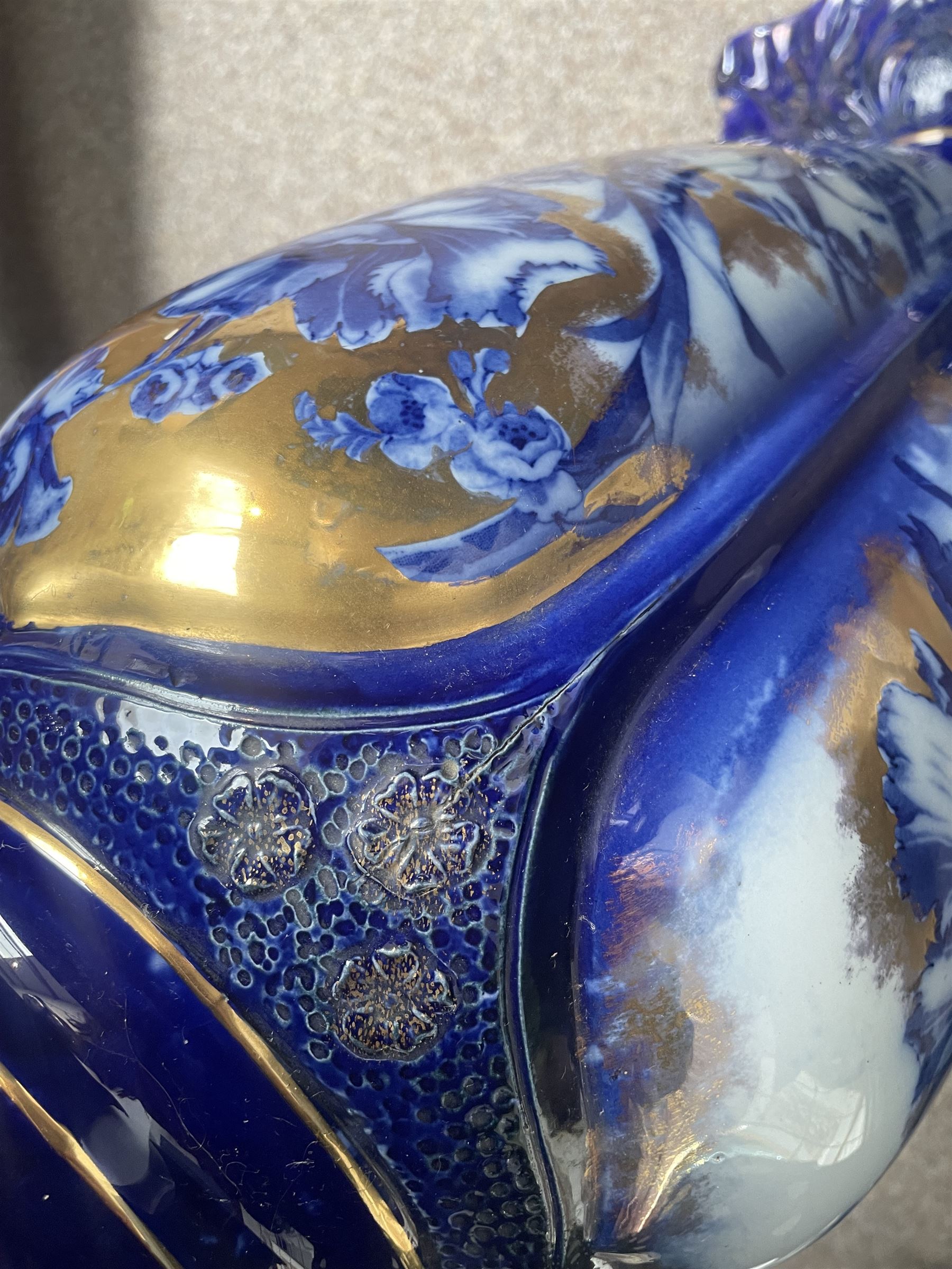 Staffordshire pottery jardiniere, decorated with flowers in blue and heightened in gilt, overall H46cm 