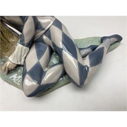 Lladro figure, Harlequin Reclining, modelled as a recumbent harlequin, no 5128, Sculpted by Salvador Furio, year issued 1982, year retired 1987, H28cm 