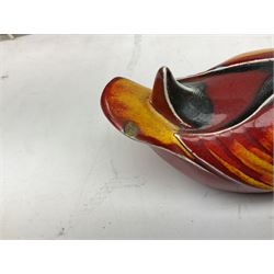 Collection of Poole Pottery, comprising charger and vase in Volcano pattern and a duck figure in a similar pattern 