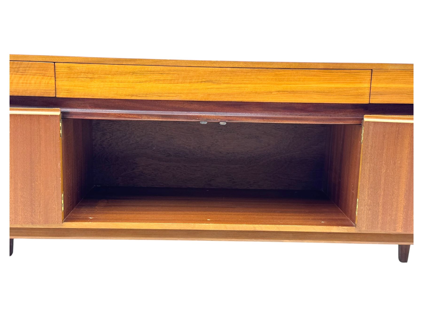 Younger - 1960s teak sideboard, three drawers over three cupboard, centre draw lined with baize with dividers, recessed handles with tapered feet