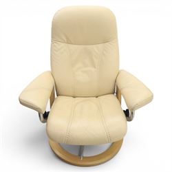 Ekornes - Stressless reclining beige leather armchair and stool, raised on brushed steel frame, light oak rotating base