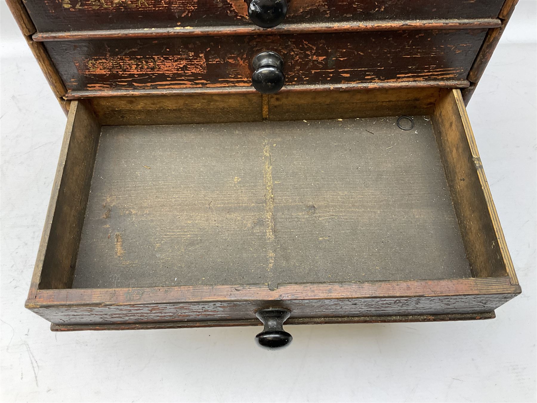 Early 20th Century Dewhurst table top chest, decorated with gilded 'Dewhurst's Sylko Machine Twist Strong Lustrous' lettering above six long drawers with names and numbers of cotton also detailed in gilt, H39cm