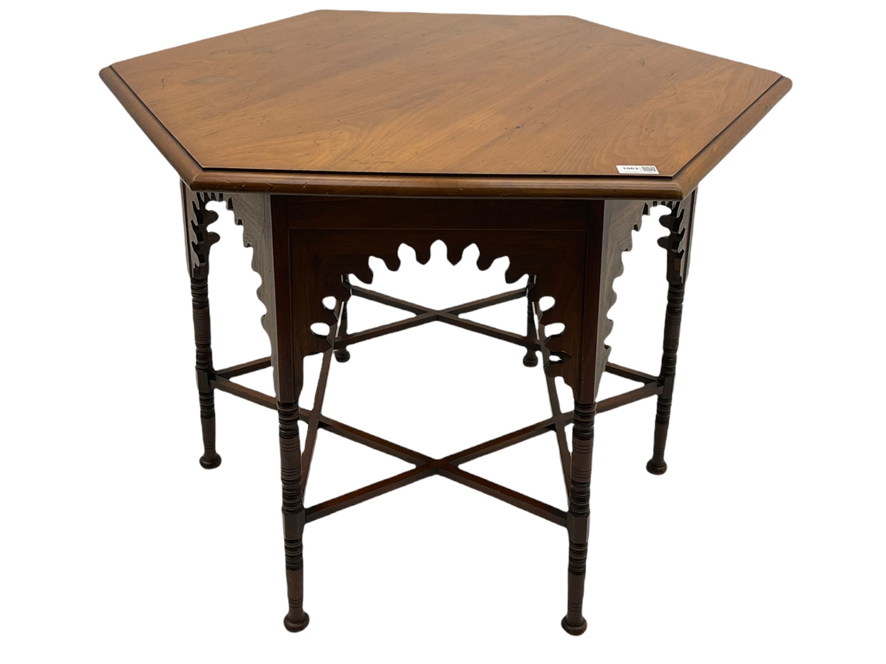 Liberty & Co circa 1890 - walnut centre table, hexagonal form, fretwork frieze, star stretcher base, turned supports on button feet. Stamped on underside.
Featured in - Pictorial Dictionary of British 19th century Furniture Design, Daryl Bennett Liberty's Furniture, 1875-1915, The Birth of Modern Design.
Liberty Style, The Classic Years, 1898 - 1910, by Mervin Levy.