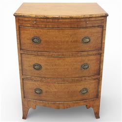Georgian design bow front chest in figured walnut veneers, with moulded top over a pull-out brushing slide and three long drawers fitted with oval brass drop handles, raised upon swept bracket feet