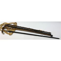Edwardian thorn walking cane with silver mounts, by J.H, Birmingham 1909, a 1920's evening walking cane with silver finial, two other walking canes and a rattan carpet beater (5)