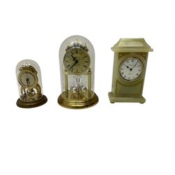 Two contemporary battery driven quartz mantle clocks and a spring driven balance wheel clock