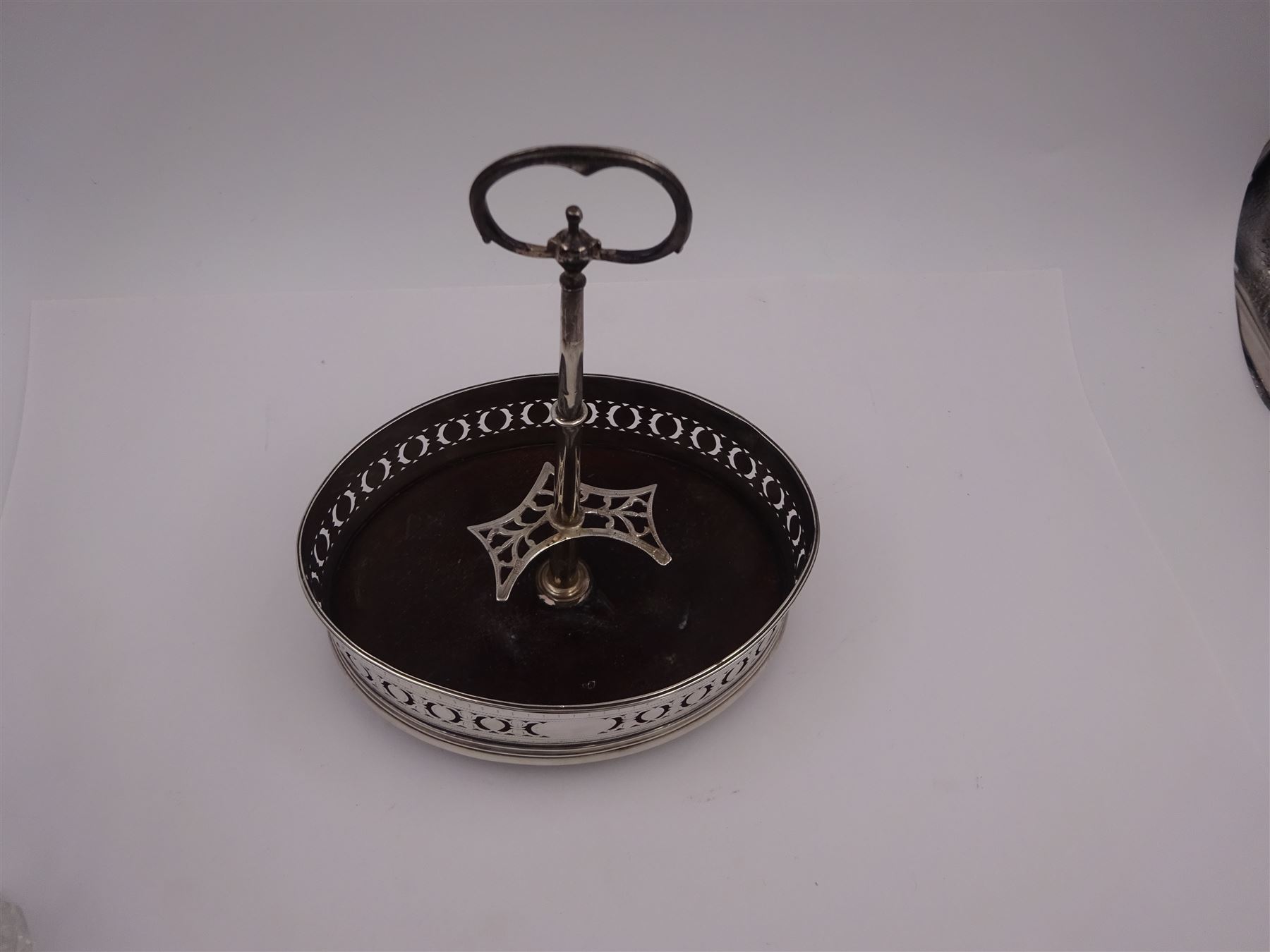 Late 18th century silver cruet stand, of oval form, with pierced sides upon four bun feet, hallmarked to handle Hester Bateman, all other hallmarks indistinct, together with five matched silver mounted cut glass cruet bottles, including some later Victorian examples, hallmarks predominantly indistinct, stand H20cm