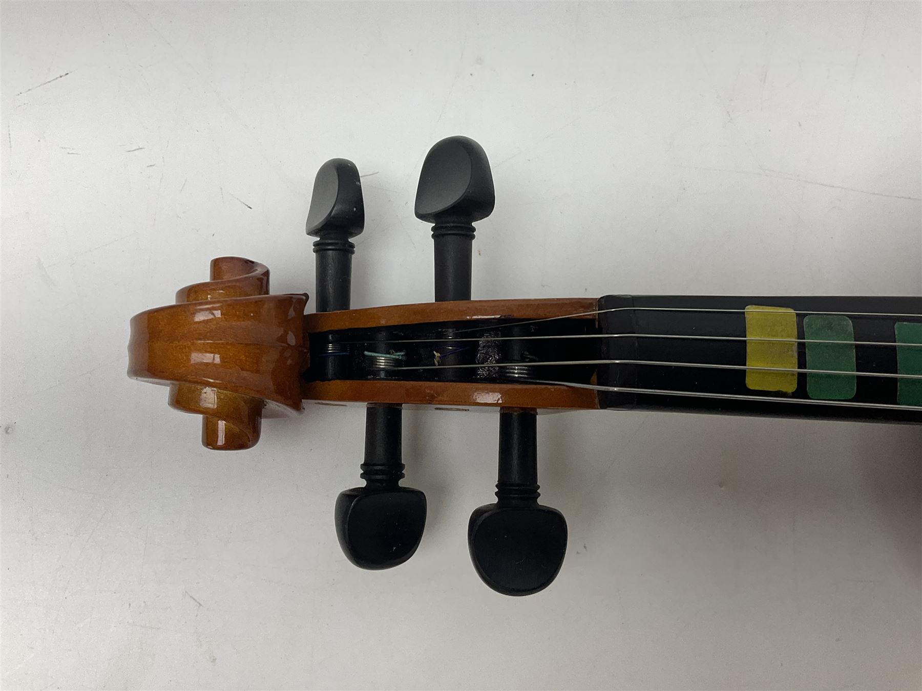 Four student violins - two Chinese three-quarter size with 33.5cm and 34cm two-piece backs; Stringers of Edinburgh quarter size with 28cm two-piece back; and Stentor quarter size with 28cm two-piece back; each in carrying case (4)