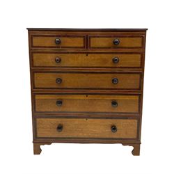 Early 19th century oak and mahogany banded chest, two short and four long graduating drawers with turned rosewood handles