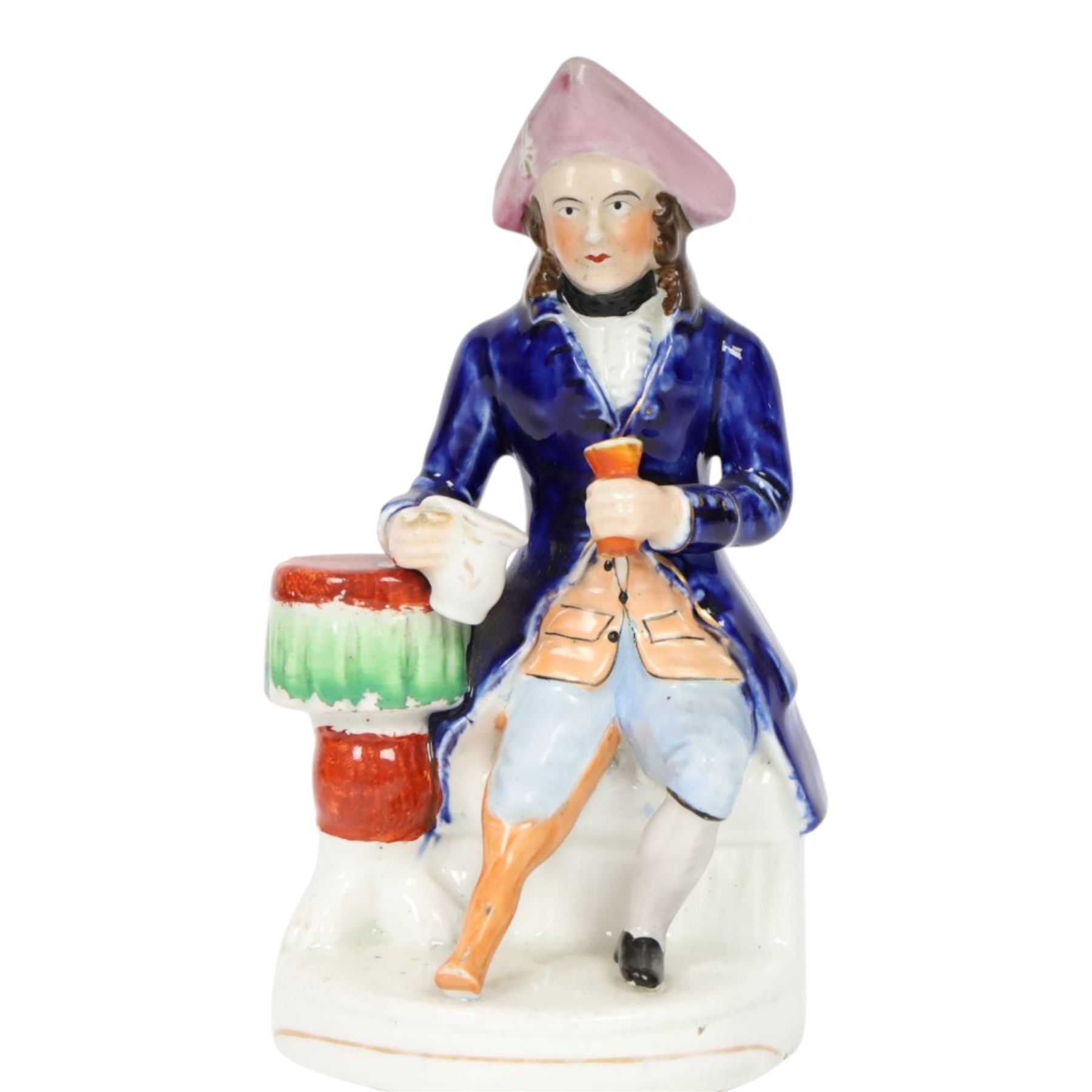 Mid 19th century Staffordshire figure of a Greenwich Hospital pensioner, circa 1850, modelled as a seated sailor with a peg leg, his left arm holding a goblet, his right leaning upon a table and holding a jug, wearing naval uniform and tricorn hat, H21cm
