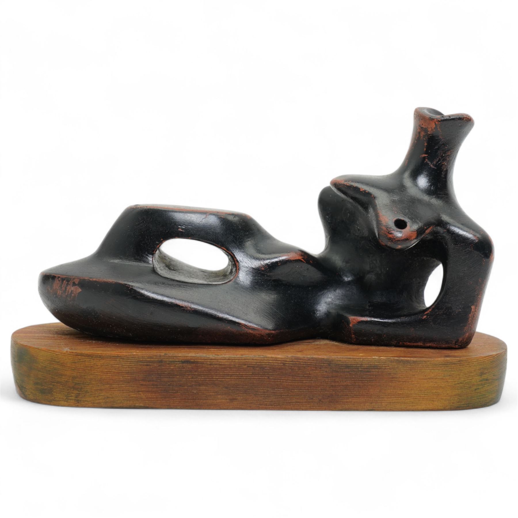 After Henry Moore (British 1898-1986): 'Reclining Figure', terracotta maquette sculpture, base marked with affixed catalogue label inscribed ‘Reclining Figure: 1939 Archive 0074229', W20cm H12cm
Notes: the original is on display at the Tate Britain