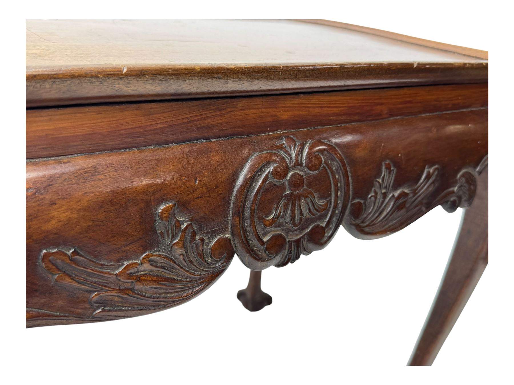 Late 19th to early 20th century mahogany side table, rectangular top with applied raised moulding, curved upper rails carved with C-scroll cartouches and extending curled leaves, bellflower carved cabriole supports with ball and claw feet 