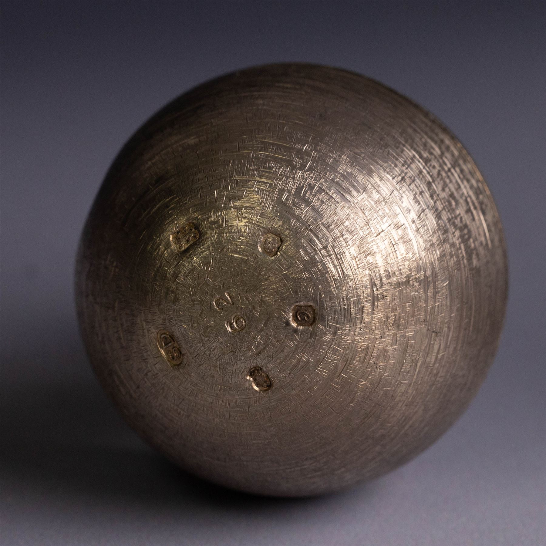 Stuart Devlin - Late 20th century silver and silver-gilt surprise egg, the textured gilt exterior opening to reveal an underwater scene with two fish and an anchor, hallmarked Stuart Devlin, London 1977, boxed, H10cm