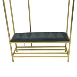 Contemporary hall stand gilt metal with black velour seat, oval mirrored panel with multiple hooks, padded seat above undertier for shoes