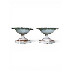 Coalbrookdale - pair of 19th century cast iron petal rim urns, squat form on square plinth...