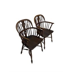 Pair late 20th century oak Windsor elbow chairs, double hoop and stick back with pierced and fretwork work splat, dished seat on turned supports joined by crinoline stretcher