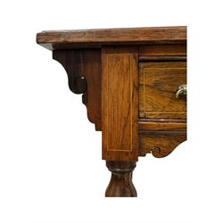 Late Victorian walnut writing table, rectangular leather-inset top surmounted by a brass gallery, fitted with a single frieze drawer, raised on turned tapering supports with lower undertier and ceramic castors