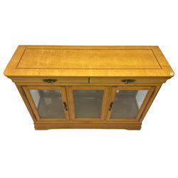 Yew wood sideboard, rectangular top with mahogany and ebony stringing, fitted with two drawers over three glazed cupboard doors enclosing glass shelves