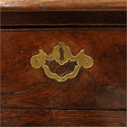 George III oak dresser base, rectangular top with moulded edge, fitted with two drawers over shaped spandrels, raised on square chamfered supports united by undertier, on stile feet