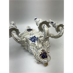 A pair of German Echt Kobalt blue and white wall sconces, the shaped plaques decorated with central floral spray in blue, supporting three scrolling branches, heightened throughout in gilt, H43cm. 