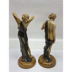 After Ferdinand Preiss (1882-1943), pair of Art Deco style, composite semi nude classical female figures, raised on circular onyx bases, H21cm