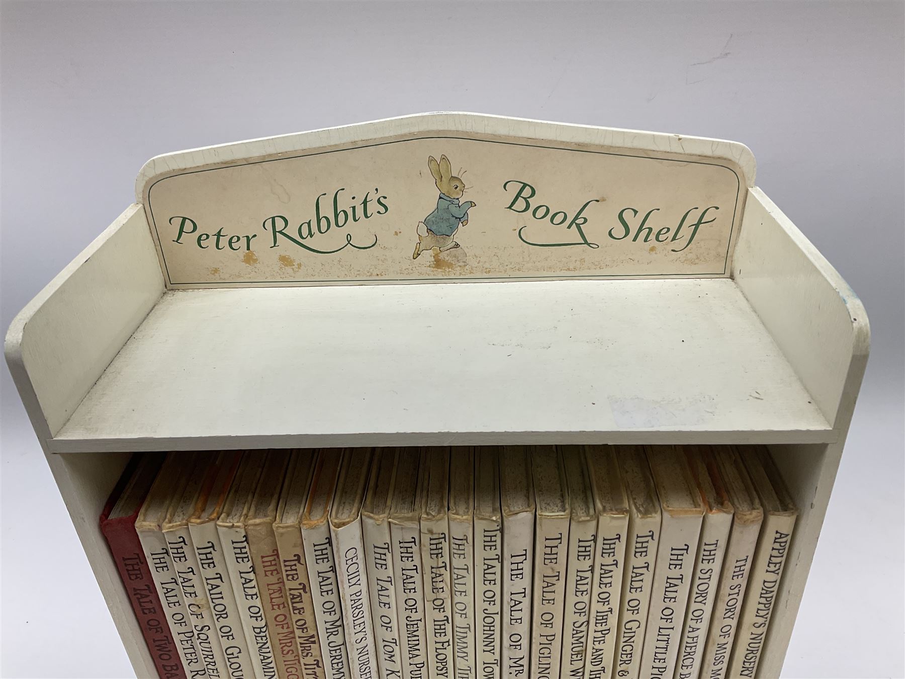 'Peter Rabbit's Book Shelf', containing selection of Beatrix Potter books, mostly library editions, shelf H29cm L27.5cm D11.5cm