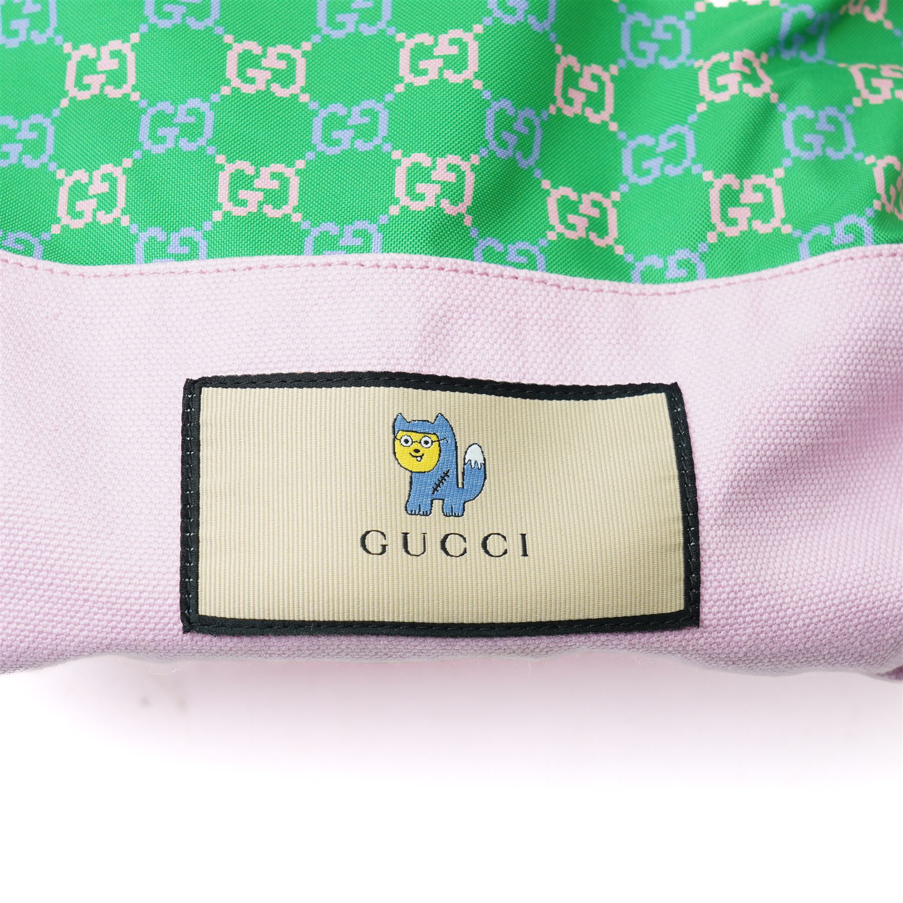 Gucci x Palace skateboard, Spring/Summer 2021, green GG monogram wood deck with multicolour ‘AH AH AH! GUCCI’ lettering and cartoon character mascot motif, fitted with Gucci-branded metal trucks and red and cream wheels, model no. 689103 JCGMN, presented with original GG monogram drawstring dust bag, protective sleeve, outer box and accompanying cards, Skateboard L81cm W20cm