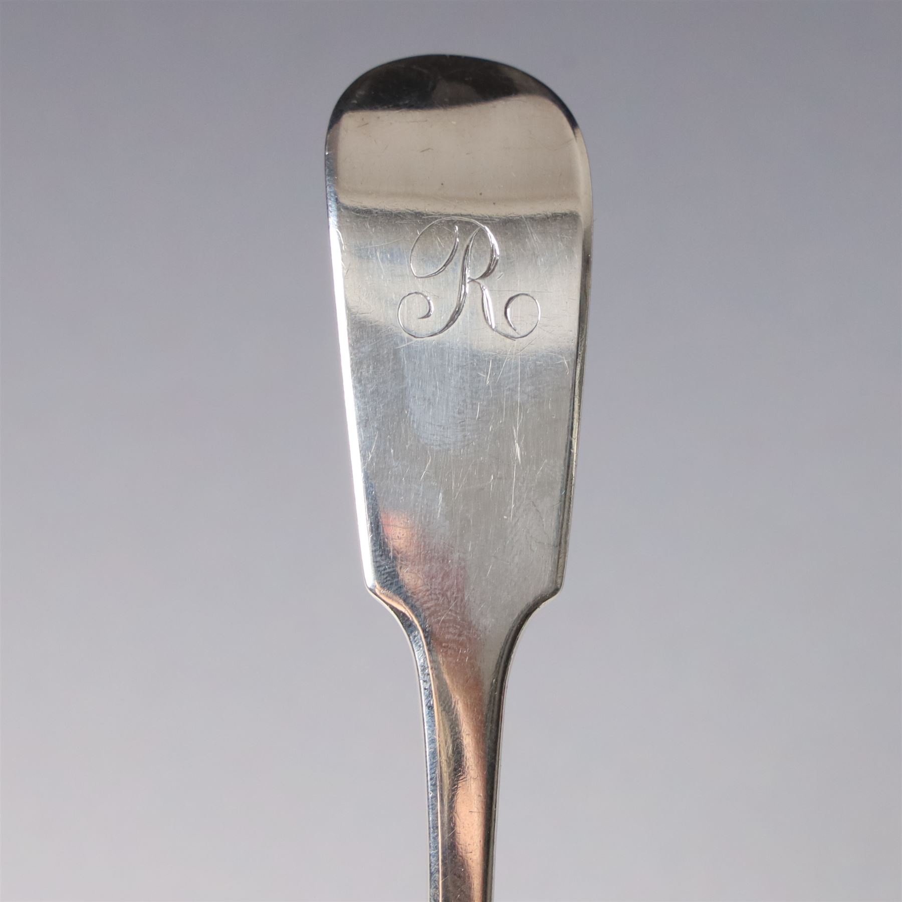 19th century Scottish silver fiddle pattern toddy ladle, Edinburgh 1837 Maker Millidge & Son, another Edinburgh 1835 Maker James McKay, George IV silver sauce ladle with fluted bowl London 1825 Maker Charles Eley and an Edwardian sauce ladle (4)