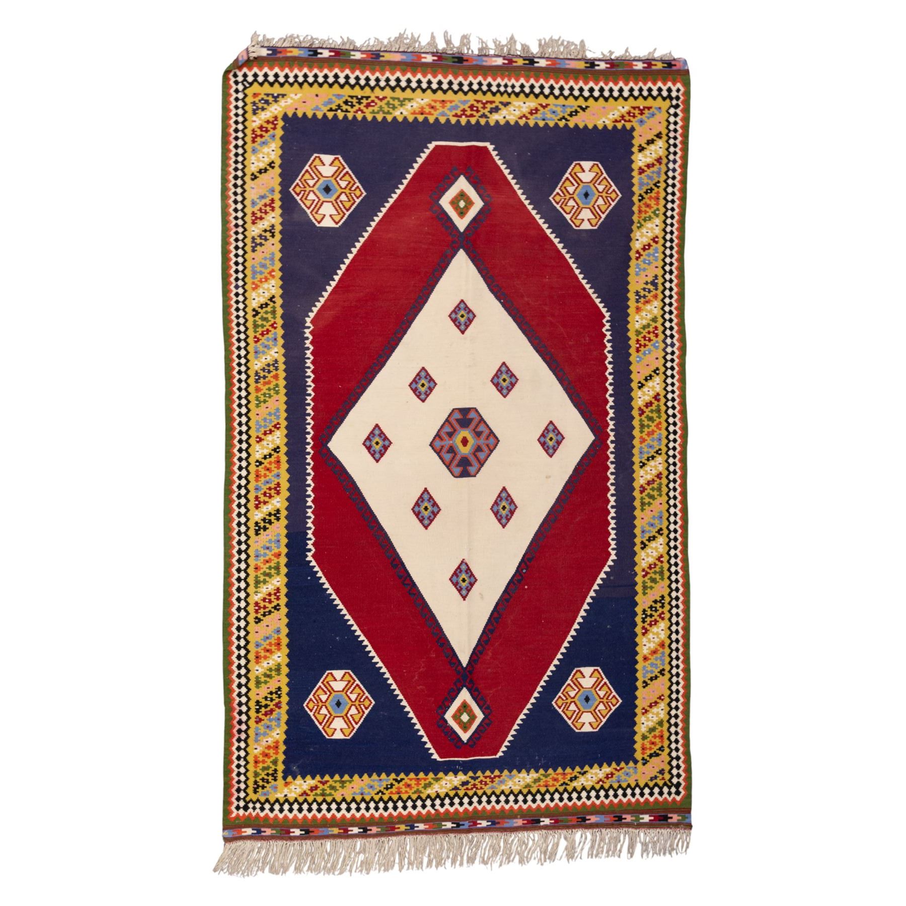 South West Persian Qashqai kilim, woven in flatweave with tones of indigo blue, madder red, yellow, turquoise, and green, with a bold central diamond medallion on an ivory ground, enclosing smaller lozenge motifs and flanked by deep madder red panels, field framed by a broad indigo border with polychrome geometric devices and serrated motifs 