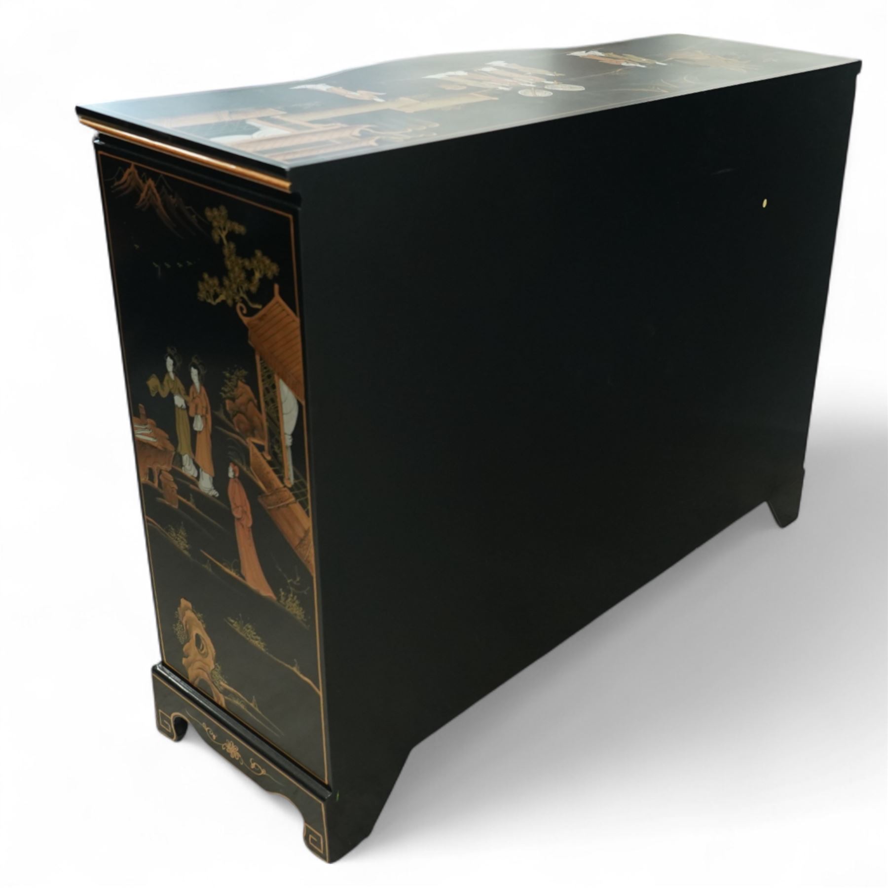 Late 20th century Chinese black lacquered sideboard, serpentine front fitted with three baize-lined drawers over four panelled cupboard doors, decorated throughout with gilt and polychrome figural and landscape scenes, on shaped apron and bracket feet 