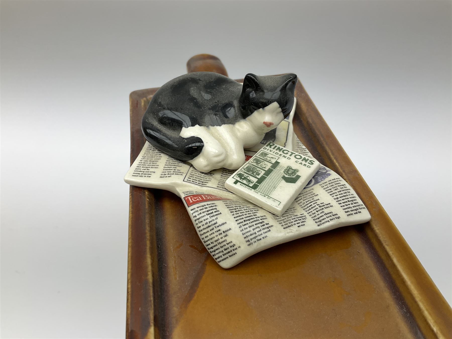 Three Ringtons novelty teapots, comprising The Ringtons Van teapot, the Tea Merchant teapot, and Millenium Celebration teapot. 