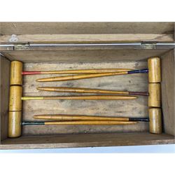 Hamley's table top croquet set with six turned wooden mallets, four balls with different coloured rings, eight hoops, two centre pegs and two table clamps, in wooden box L39cm
